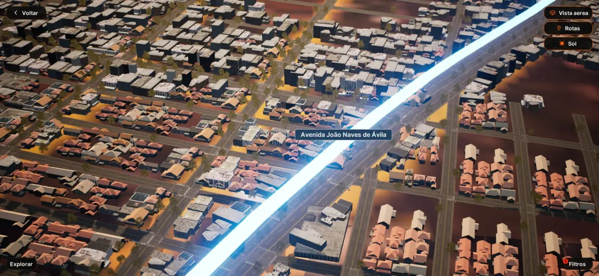 Mapa 3D da cidade no aplicativo Vizyro com uma rota iluminada na Avenida João Naves de Ávila e os botões Vista aérea, Rotas e Sol